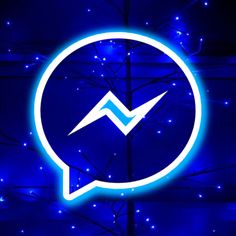 a blue illuminated sign with an arrow in the center