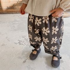 Kids Flower Print Trouser Harem Pants – Petite Monstre Playful Spring Pants, Playful Cotton Pants For Fall, Playful Spring Pants With Pockets, Playful Relaxed Fit Pants For Spring, Playful Spring Bottoms With Pockets, Playful Bottoms With Elastic Waistband For Fall, Spring Gray Bottoms, Cotton Harem Pants, Harem Trousers