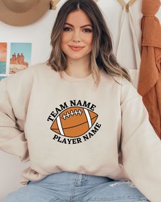 Custom Football Sweatshirt, Personalized Team Name Sweater, Football Mom Hoodie, Football Team Sweater, Football Player Gift Sweatshirt Hi all, welcome to the Comfy Tee Design, It's so nice to see you here. If you are looking for soft, comfy and high quality sweatshirts, I have good news for you: You're at the right place!  Sweatshirts are unisex sizing. It's proper, comfortable and flattering for men and women, but may run  large for the ladies. Please see the size chart to find your perfect fi Fall Season Team Logo Sweatshirt, Collegiate Long Sleeve Sweatshirt With Team Logo, Long Sleeve Fleece Top With Team Logo, Long Sleeve Sweatshirt With Ribbed Cuffs For Sports, Ribbed Cuffs Long Sleeve Sweatshirt For Sports, Team-colored Fall Sweatshirt With Team Logo, Team-colored Sweatshirt With Team Logo For Fall, Team Spirit Long Sleeve Sweater For College, Fall Varsity Sweatshirt With Team Logo