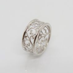 Vintage Sterling Silver Filigree Band Ring ....Marked 925...Total of weights 3.7gramsMeasure of Band 8.7MM...It's in very good condition. Elegant Wide Band Ring Stamped 925, Elegant Silver Engraved Wide Band Ring, Elegant Engraved Silver Wide Band Ring, Elegant White Gold Wide Band Ring Stamped 925, Elegant Sterling Silver Filigree Ring With Decorative Band, Sterling Silver Filigree Ring In White Gold, Sterling Silver Rings With Decorative Band, White Gold Sterling Silver Filigree Ring, Hallmarked White Gold Engraved Ring With Wide Band