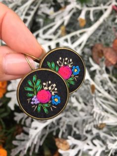 Embroidered earrings, OOAK, herbs, wildflowers, meadow, bohemian, hippie, retro jeweller, black, bra Bohemian Black Flower Earrings For Gift, Bohemian Floral Embroidery Earrings For Gifts, Bohemian Floral Embroidered Earrings As Gift, Black Embroidered Bohemian Jewelry, Bohemian Black Embroidered Jewelry, Hand Embroidered Jewelry, Embroidered Necklace, Wooden Hoop, Knit Stitch