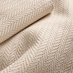 the textured fabric is beige and white