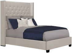 a bed with blue and white pillows on it's headboard, in front of a white background