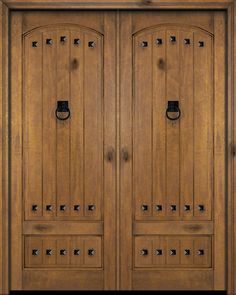 two wooden doors with metal handles on them