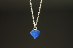 "Minimalist heart pendant necklace made especially as a Valentine's Day Gift. This dainty necklace is made with lapis lazuli heart pendant and sterling silver flat cable chain. All the findings ( lobster, head pins, and jump rings ) are in sterling silver as well. Perfect unique gift for her , for women, wife, loved ones or yourself. Due to the handmade nature of this Lapis stones, shapes and color may slightly differs from the picture making them uniquely yours. Color : Genuine Lapis Lazuli heart Finish : Everything is in sterling silver. Length : Please select your choice of length. For more choice on my Valentine Gifts please, refer to the link below: https://www.etsy.com/shop/NtikArtJewelry?ref=seller-platform-mcnav To visit my shop \"NtikArtJewelry\" : https://www.etsy.com/shop/NtikAr Handmade Heart Charm Necklace For Everyday, Minimalist Handmade Heart Necklace For Everyday, Everyday Minimalist Handmade Heart Necklace, Minimalist Nickel-free Necklace For Valentine's Day, Handmade Minimalist Heart Necklace For Valentine's Day, Simple Heart Necklace For Gift, Simple Nickel-free Charm Necklaces As Gifts, Simple Nickel-free Charm Necklaces For Gifts, Simple Nickel-free Charm Necklace As Gift