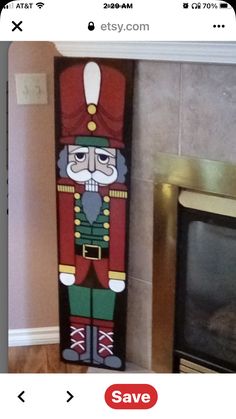 a large wooden nutcracker standing next to a fire place