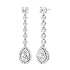 The teardrop-shaped diamonds are the centerpiece of these earrings. Their graceful shape adds movement and flow to the design, creating a captivating and elegant look. Diamond White Pear-shaped Teardrop Earrings, White Pear-shaped Teardrop Earrings With Diamond Accents, Elegant White Gold Pear-shaped Chandelier Earrings, Luxury Pear-shaped Diamond White Chandelier Earrings, White Pear-shaped Chandelier Earrings In Fine Jewelry, Blue Wedding Band, Dangler Earrings, Something Blue Wedding, Gorgeous Engagement Ring