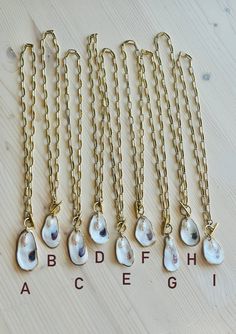 A truly One-of-a-Kind statement piece. Hand painted gold leaf natural oyster shell pendants with gorgeous freshwater pearls, on high quality 12K Gold over brass chain with toggle front closures. Each shell has been harvested in our Charleston, SC rivers and are carefully hand finished to create its one-of-a-kind appearance. No two shells are alike. Each oyster shell has its own story behind its journey to the shore. The size, shape and colors in each one will vary and that is what makes each she Journey To The Shore, Oyster Shell, Shell Pendant, Shell Necklaces, Charleston Sc, Brass Chain, Ring Bracelet, Gold Leaf, Earring Necklace