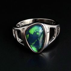 "Natural Australian black Opal triplet Sterling Silver Ring, one-off piece of natural opal set in sterling silver in a modern design.  Please note: All my Australian black Opals are one-off pieces so some rings will need to be resized to your size once the order is placed, please allow 4-5 working days for me to change the size for you.  Made of solid British Sterling Silver with rhodium plating.  Rhodium-plated silver is fine sterling silver that is polished and dipped in rhodium. It has a brig Classic Opal Jewelry With Polished Finish, Silver Opal Cabochon Ring In Fine Jewelry Style, Silver Opal Ring With Polished Finish, Black Oval Opal Jewelry, Oval Black Opal Jewelry, Formal Silver Opal Birthstone Ring, Natural Opal Ring, Australian Black Opal, Cosmic Consciousness