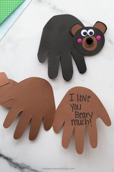 two handprints with the words i love you, baby much and an animal