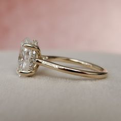 a close up view of a ring with a diamond on it's center stone