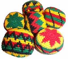 four crocheted balls sitting on top of each other