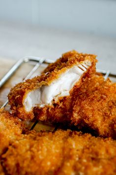 some fried food sitting on top of a metal rack