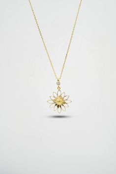 14 K Gold Daisy Necklace This Fine Jewelry Gold Necklace is ideal for the special woman in your life. The beautiful 14 K Gold Daisy Necklace displays a stunning and delicate daisy made of gold. Each petal is intricately crafted to create a gorgeous daisy that is sure to make an extraordinary statement. The gentle curves of the daisy will perfectly frame her face, and its shimmering gold is sure to catch everyone's eye. This stunning piece of fine jewelry is both bold and delicate, perfect for an White Fine Jewelry Necklaces With Flower Charm, White Flower Charm Necklace Fine Jewelry, Fine Jewelry White Flower Necklace, White Flower Shaped Fine Jewelry Necklace, White Flower Fine Jewelry Necklace, White 14k Gold Necklace For Her, 14k Gold White Flower-shaped Jewelry, White 14k Gold Flower-shaped Jewelry, White 14k Gold Jewelry In Flower Shape