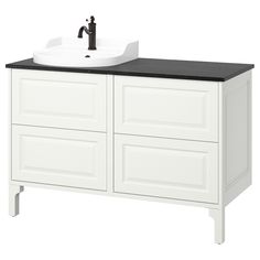 a bathroom vanity with black counter top and white cabinetry on the bottom, along with a sink