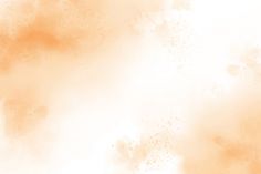 an orange and white watercolor background with some spots on it's surface,