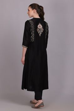 Black kurta with sequin embroidered front, back yoke and sleeves. Paired with a plain straight pant and an embroidered dupatta with tassels on hem. - Aza Fashions Embellished Black Traditional Wear For Navratri, Black Embellished Salwar Kameez For Festivals, Black Embellished Kurta For Festive Occasions, Black Silk Traditional Wear With Mirror Work, Embellished Fitted Chanderi Kurta, Festival Embellished Black Salwar Kameez, Festive Embellished Black Salwar Kameez, Festive Black Embellished Salwar Kameez, Embroidered Straight Kurta In Black