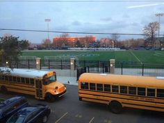 two school buses parked in a parking lot