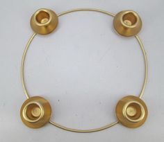 brass plated metal ring with four round knobs