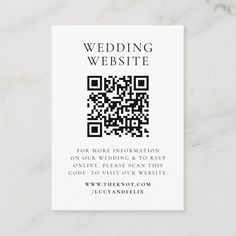 a white business card with a qr code on the front and bottom corner, that says wedding website