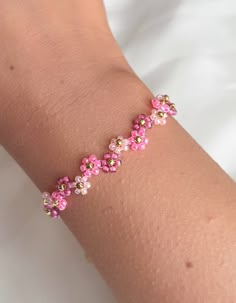 Pink Flower Beaded Bracelets For Summer, Pink Dainty Beaded Bracelets For Spring, Dainty Pink Beaded Bracelets For Spring, Spring Pink Jewelry With Colorful Beads, Pink Flower Beaded Bracelets Dainty Style, Pink Flower Beaded Bracelet, Adjustable Pink Flower Beaded Bracelets, Pink Dainty Flower Beaded Bracelets, Dainty Pink Flower Beaded Bracelets