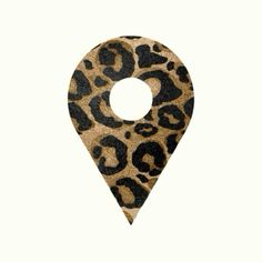 a brown and black animal print pin marker on a white background with the shape of a circle