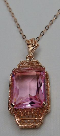 "Simulated Pink Topaz Pendant Lantern Design#P13 Custom Made This is a lovely Art Deco reproduction of a brooch that I fell in love with. Fashioned in the design of the brooch, I now offer this lovely Antique reproduction pendant in rose gold plated sterling silver (matching 18ct earrings also available for sale). The flawless simulated 9ct Pink Topaz is 15mm long (just over 9/16\") and 12mm in width (1/2th\"). The pendant is 1 3/8th inches long, it is 9/16th\" wide. The bail opening is 3.5mm wi Rectangular Rose Gold Jewelry For Evening, Elegant Pink Engraved Necklace, Pink Antique Hallmarked Jewelry, Antique Hallmarked Pink Jewelry, Antique Pink Hallmarked Jewelry, Antique Pink Jewelry For Formal Occasions, Victorian Pink Jewelry For Formal Occasions, Formal Antique Pink Jewelry, Vintage Rose Gold Jewelry With Intricate Design