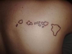 a map tattoo on the back of a woman's left shoulder, which is drawn in black ink