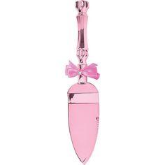 a pink glass bottle with a bow on it's top hanging from a hook