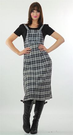 This cute Vintage 90s plaid dress is fashioned of rayon and is black and white in color. The 90s grunge dress has lightly padded shoulders and ties in back. There is no marked size; It fits like a Medium. The 90s vintage dress slips over the head. It is unbranded. This vintage grunge dress would make a very cute back to school dress for fall.  CONDITION Very good; Dress has one or 2 very pale stains on the front MEASUREMENTS All measurements are taken with the garment lying flat and then doubled. Bust: 36 Waist: 30 Hip: 40 Shoulders: 17 Shoulder to hemline: 46 Model measures Bust 34, Waist 26, Hip 36. Heather is 5'10" tall. SHIPPING: Once your order is processed you can expect your package to ship the next business day and arrive in 2 to 5 business days. MORE: Like what you see? Find more Plaid Dress Grunge, 90s Plaid Dress, 90s Grunge Dress, 90s Vintage Dress, Dress Grunge, Good Dress, Grunge Dress, Grunge Vintage, Tartan Dress