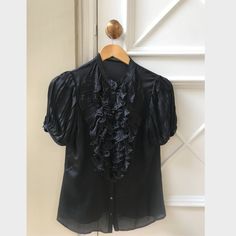 Authentic Vintage Alexander Mcqueen Shirt. Circa 2007 Worn Only A Few Times. In Excellent Used Condition Size 42 Designer Short Sleeve Formal Tops, Luxury Black Shirt For Spring, Luxury Fitted Ruffle Tops, Designer Silk Blouse With Short Sleeves, Classic Black Silk Tops, Elegant Black Short Sleeve Shirt, Elegant Silk Short Sleeve Shirt, Elegant Short Sleeve Silk Shirt, Black Formal Shirt With Ruffles