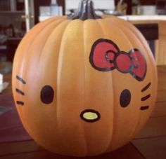 a hello kitty pumpkin sitting on top of a table