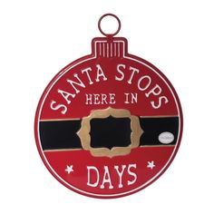 a red ornament that says santa stops here in days