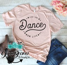 Livin that Dance mom Life tee, ballet Mom, Dance Mom shirt, gifts for moms by GinaBeanaDesignCo on Etsy https://www.etsy.com/listing/623361935/livin-that-dance-mom-life-tee-ballet-mom Dance Shirts Ideas, Dance Mom Gifts, Ballet Mom, Dance Mom Shirt, Dance Mom Shirts, Gifts For Moms, Cute Shirt Designs