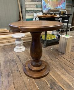 a wooden table sitting on top of a wooden floor