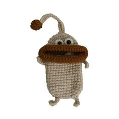 a crocheted stuffed animal with a hat and scarf on it's head