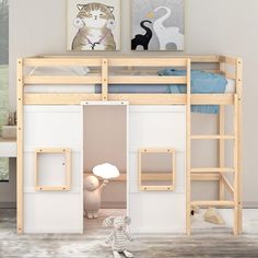 a child's bedroom with a loft bed and ladder to the top bunk area