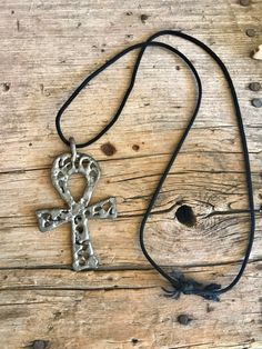 Fabulous handmade ankh cross pendant. It almost looks like solder but it is a harder material. Mark:  Unmarked  My sterling and silver items are all with the original patina as when I acquired them. I leave the polishing up to the buyer. *Please visit my shop to find other great vintage items. https://www.etsy.com/shop/SionainnRiverVintage A picture is worth 1000 words. I work very hard to provide you with accurate, detailed pictures of the items that I am selling. Please look at the pictures ca Silver Ankh Necklace In Brass, Handmade Ankh Shaped Metal Jewelry, Handmade Metal Ankh Jewelry, Handmade Artisan Ankh Jewelry, Handmade Metal Ankh Necklace, Bohemian Ankh Necklace In Metal, Silver Ankh Cross Spiritual Necklace, Silver Ankh Cross Necklace Spiritual Style, Silver Ankh Cross Necklace In Spiritual Style