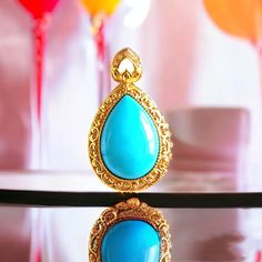 **Teardrop Turquoise Pendant** Its beautiful legend: ♥ A symbol of serene beauty. This pendant features a captivating teardrop-shaped turquoise gemstone, set in a lavishly detailed gold frame.  ♥ The vibrant hue of the turquoise, reminiscent of tropical waters, is perfectly complemented by the intricate scrollwork of the gold, which adds a touch of baroque elegance to the design.  ♥ The "Teardrop Turquoise Pendant" is a versatile piece that brings a hint of luxury and sophistication to any outfi Turquoise Drop Jewelry Gift, Turquoise Drop Jewelry As A Gift, Elegant Turquoise Teardrop Pendant Jewelry, Blue Cabochon Drop Jewelry, Blue Drop Jewelry With Cabochon, Blue Drop Cabochon Jewelry, Luxury Turquoise Teardrop Jewelry, Teardrop Necklace, Nature Jewelry