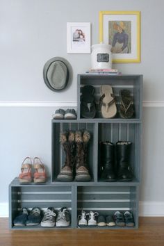 a shelf with shoes and pictures on it