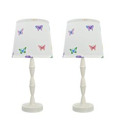 two white lamps with colorful butterflies on them