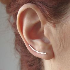 "These ear climber earrings are made of Eco-friendly solid 950 silver. These earlobe earrings are slightly curved following the contour of the ear. 🌼 Nickel-free. ✔️ The wrap earring is 0.94\" (24 mm) long. ✔️ Ball width: 0.07\" (1,7 mm). ✔️ The ear wire is 0.35\" (0.9 mm) in diameter. They are very comfortable. Simply pass the wire through the ear hole, turn and position on the natural curve of the ear. Perfect for everyday wear, single or in combination with other earrings. ✔️ Sold alone or a Minimalist White Ear Cuff, Everyday Rose Gold Sterling Silver Ear Climbers, Minimalist Rose Gold Sterling Silver Ear Climbers, White Minimalist Ear Climbers, Minimalist Rose Gold Ear Climbers For Pierced Ears, Minimalist White Sterling Silver Ear Cuff, Minimalist Rose Gold Pierced Ear Climbers, Dainty Rose Gold Sterling Silver Ear Climbers, Sterling Silver White Ear Climbers