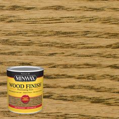 a can of minwax wood finish sitting on top of a wooden flooring