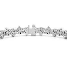 An absolute showstopper, this diamond tennis bracelet will have all eyes on your wrist. It features marquise diamonds and round diamonds arranged in a fanciful pattern to create a row of diamonds with gently undulating arches. This tennis bracelet is lovely on its own, but lovelier when worn with bangles and dainty chains. Marquise Diamond Bracelets With Diamond Accents, Marquise Diamond Accent Bracelets For Anniversary, Marquise White Gold Tennis Bracelet With Diamond Accents, Diamond White Marquise Tennis Bracelet For Anniversary, Silver Marquise Diamond Bracelet With Prong Setting, Marquise Diamond Bracelet In White Gold For Anniversary, White Gold Marquise Bracelets With Diamond Accents, White Gold Marquise Diamond Bracelet For Anniversary, Anniversary White Gold Diamond Bracelet In Marquise Shape