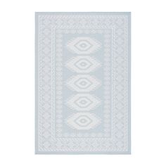 a blue and white rug with an intricate design on the bottom, in front of a white background