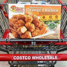 a red shopping cart with an orange chicken advertisement on it's front and side