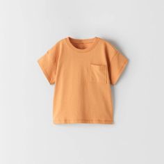 This Zara Basic Short Sleeve Light Orange Pocket Tee Is The Perfect Essential Shirt To Add To Your Little Ones Wardrobe. Zara Short Sleeve Tops With Pockets, Zara Short-sleeved Top With Pockets, Zara Short Sleeve Top With Pockets, Zara Cotton Tops With Pockets, Zara Cotton Top With Pockets, Orange Short Sleeve Tops With Pockets, Cute Crew Neck Top With Pockets, Basic Summer Tops With Pockets, Orange Cotton Tops With Pockets