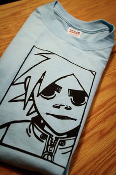 a t - shirt with an image of a person wearing sunglasses