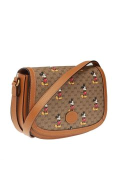 GUCCI GG Supreme Monogram Disney Mickey Mouse Shoulder Tan Brown Handbag Bag Italy NEW Mickey Mouse's playful image defines this GG canvas medium crossbody, trimmed with light brown leather details that convey a vintage look and feel. In celebration of the Lunar New Year, Disney's legendary character appears throughout Gucci's ready-to-wear and accessories for the Cruise 2020 collection, displayed as colorful prints, embroidered patches or jacquard motifs. GUCCI LIMITED EDITION DISNEY MICKEY MOU Brown Gucci Coated Canvas Shoulder Bag, Gucci Brown Coated Canvas Shoulder Bag, Gucci Canvas Bag With Adjustable Strap, Gucci Beige Crossbody Satchel, Gucci Brown Shoulder Bag Satchel, Brown Gucci Satchel With Detachable Strap, Retro Gucci Shoulder Bag, Gucci Coated Canvas Satchel For Travel, Vintage Gucci Coated Canvas Shoulder Bag