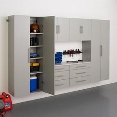 a garage with cabinets and tools in it